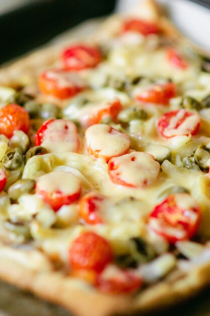 Cook preparing pizza.