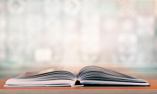 a cookbook opened on the kitchen table