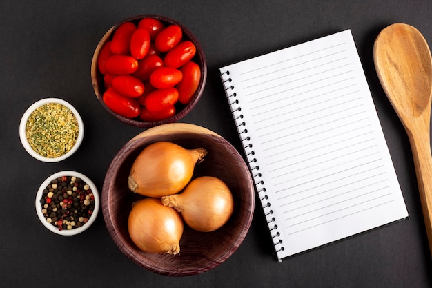 Cookbook with ingredients on the tableRecipe book