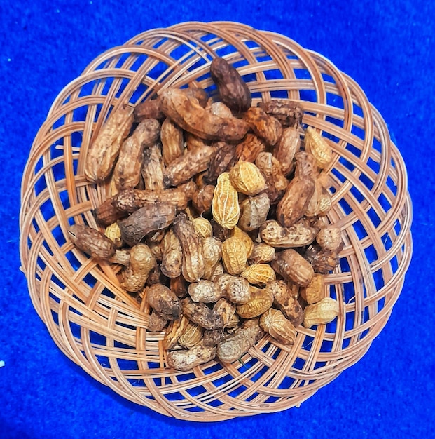 Cooked beans in woven plates on a blue carpet