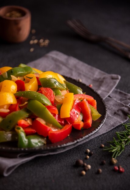 Cooked bell peppers of different colors healthy vegetable dish