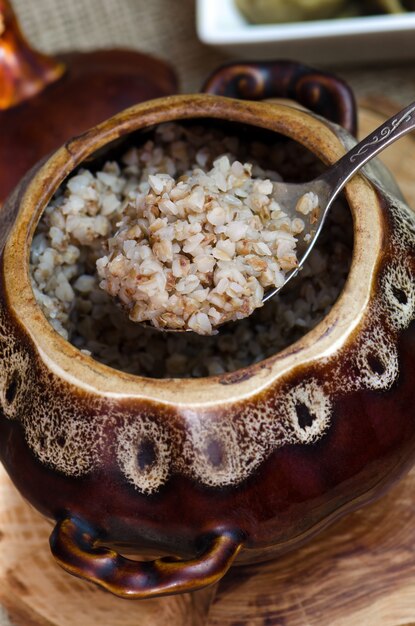 Cooked buckwheat in a clay pot