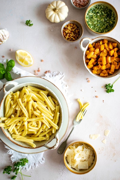 Cooked casarecce pasta in a bowl aerial view