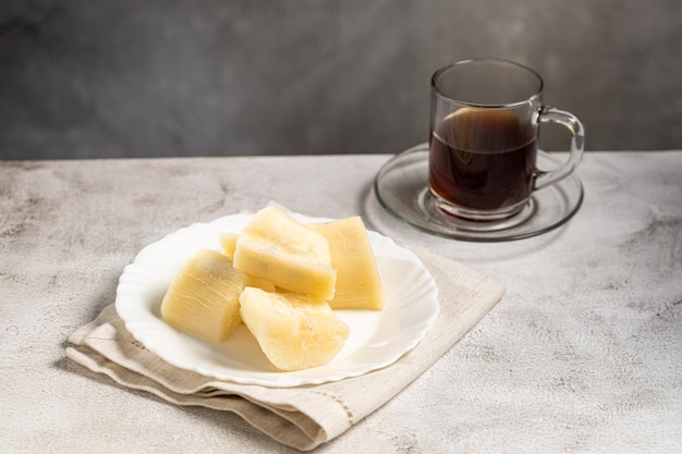 Photo cooked cassava served on plate on the table