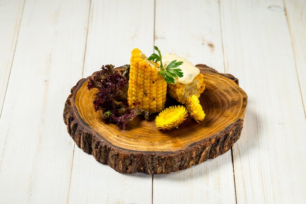 Cooked cut corn with butter on the wooden board