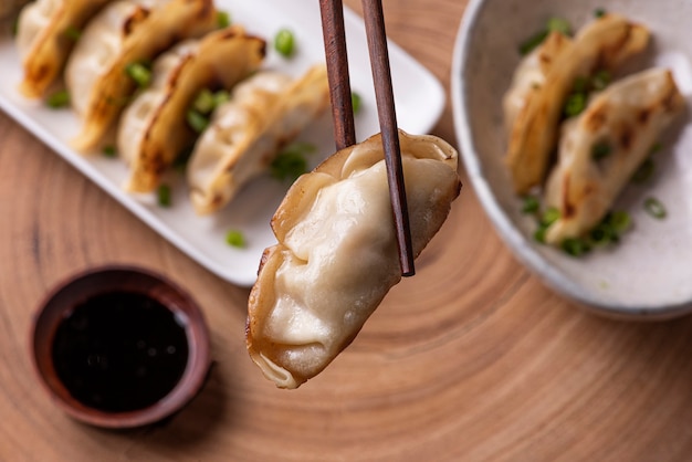 Cooked dumplings and chopsticks