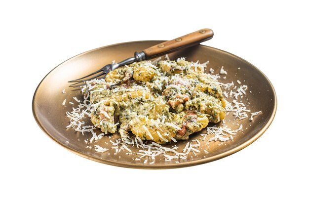 Cooked Gnocchi potato pasta with spinach and parma ham on plate Isolated on white background Top view