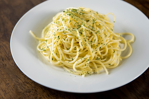 Cooked Italian spaghetti seasoning with ground parsley