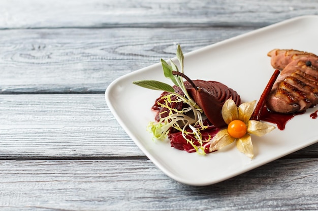 Cooked meat on white plate.