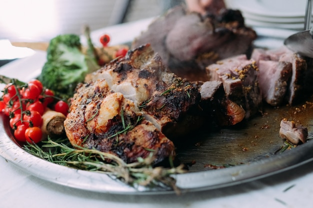 Cooked meat with mustard decorated in a metal plate