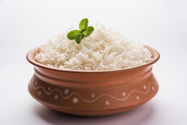 Cooked plain white basmati rice in terracotta bowl