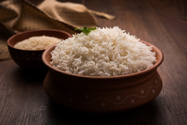 Cooked plain white basmati rice in terracotta bowl