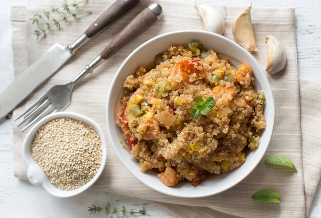 Cooked Quinoa with vegetables and shrimps in bowl