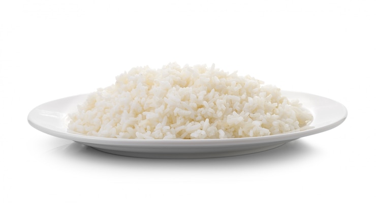 Photo cooked rice in a white plate isolated