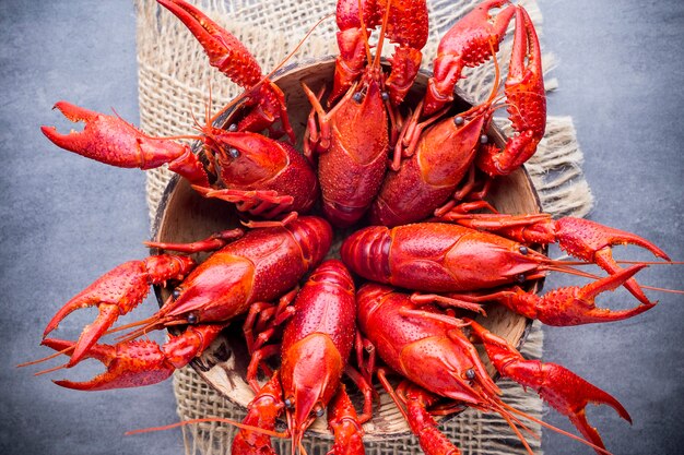 Cooked river crayfish on the grey surface.