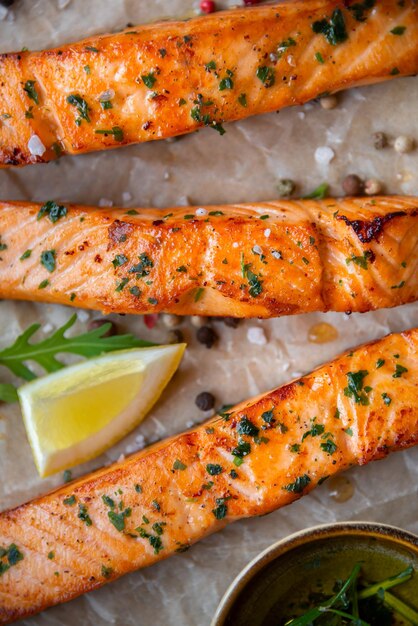 Cooked salmon fish fillet with lemon and rosemary