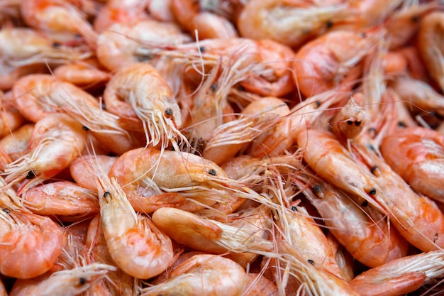 Cooked shrimp background, red with shallow depth of field