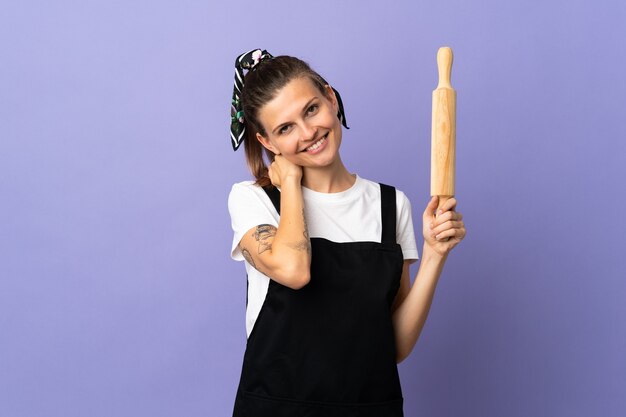 Cooker Slovak woman isolated on purple background laughing