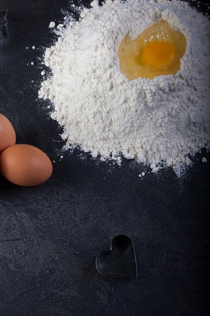 Cookie cutter, eggs and flour 