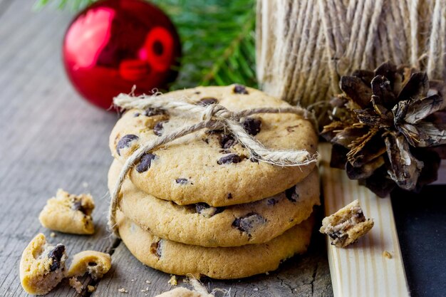 Cookie decorated with twine with Christmas branches and balls