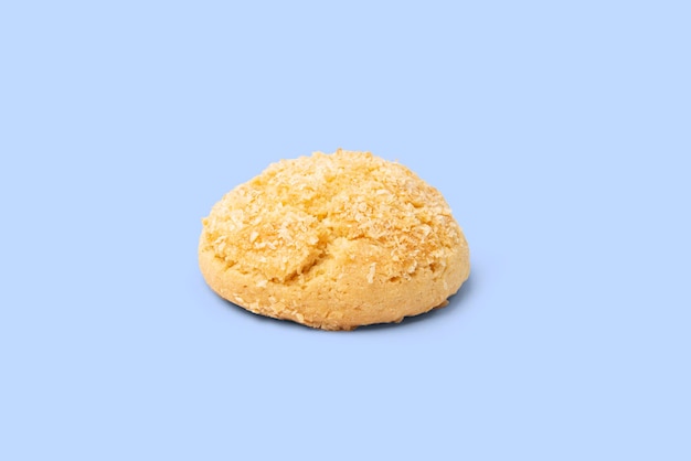 Cookie with coconut isolated on blue background