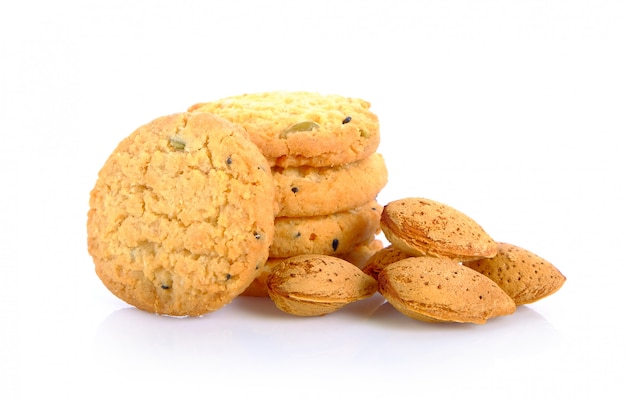 Cookies and almonds on white background