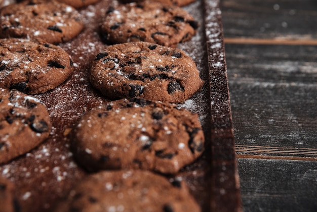 Cookies on desk on dark wooden table