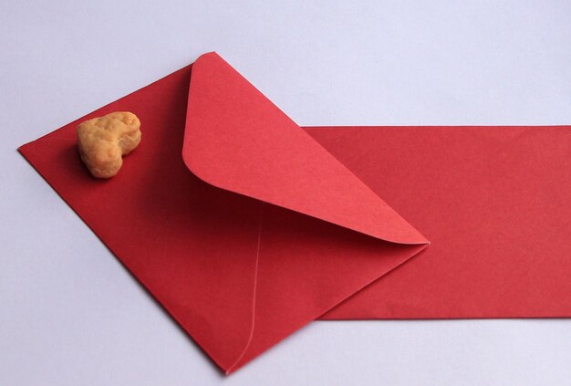 Cookies in the form of hearts for lovers on valentines day with a red envelope