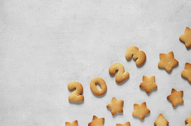 Cookies in the form of numbers 2023 on the concrete background Concept new year top view copy space