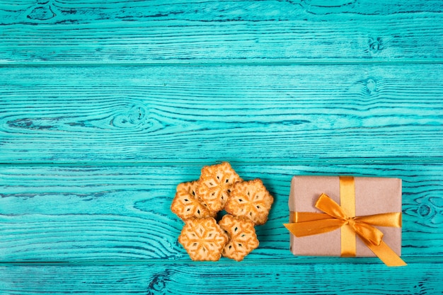 Cookies in the form of snowflakes and gift box 