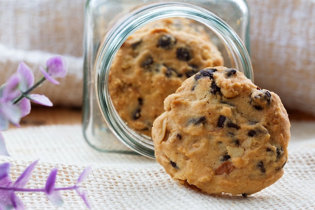 Cookies in glass jar on wood table