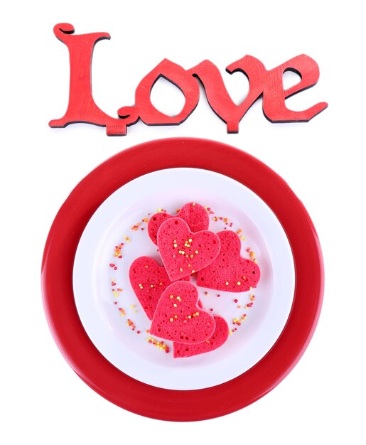 Cookies in de vorm van een hart met belettering Love geïsoleerd op wit