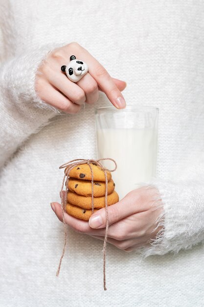 cookies and milk in the hands