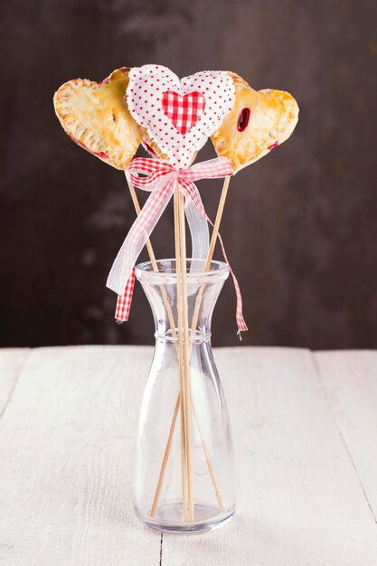 Cookies pops in the form of heart and heart from fabric