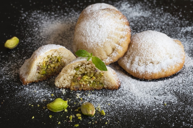 Cookies stuffed with pistachios and dates. Close up.