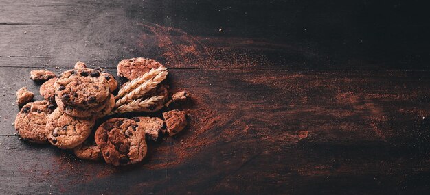 Cookies with chocolate On a wooden background Top view Free space for your text