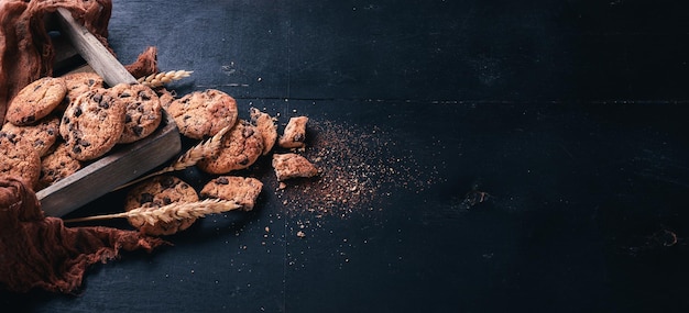 Cookies with chocolate On a wooden background Top view Free space for your text