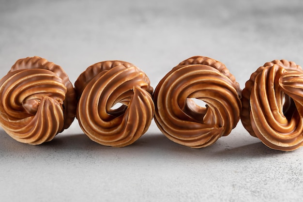 Cookies with milk chocolate marshmallows and caramel on a white background