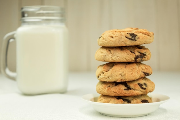 Cookies with milk closeup with space for text side view