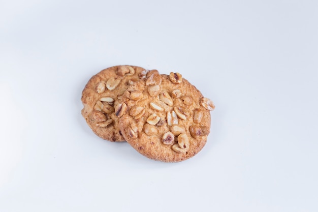 Cookies with nuts on a white wall, Delicious cookies on a white wall