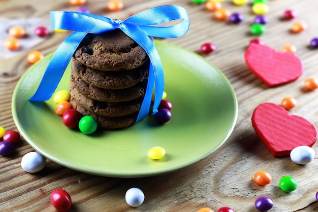 Cookies with ribbon on plate