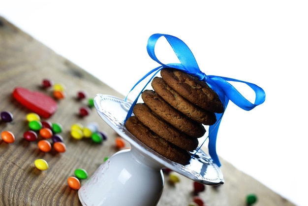 Cookies with ribbon on plate