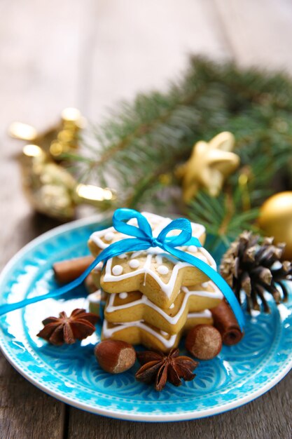 Cookies with spices and Christmas decor, on wooden table