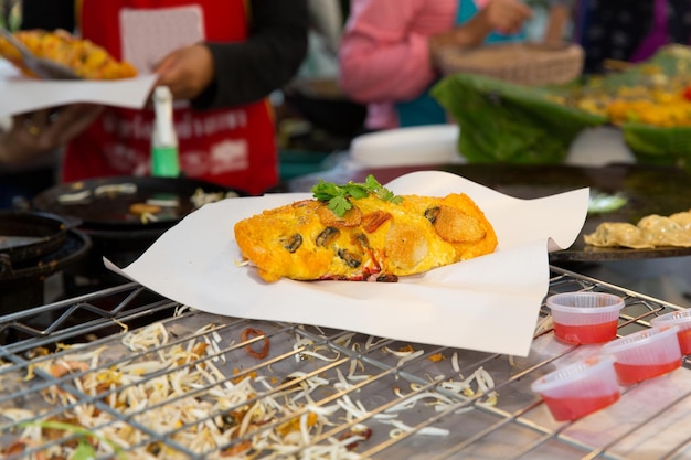 cooking, asian kitchen, sale and food concept - close up of snack at street market