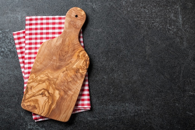 Cooking background with cutting board and kitchen towel