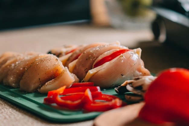 Cooking chicken french with vegetables on baking tray