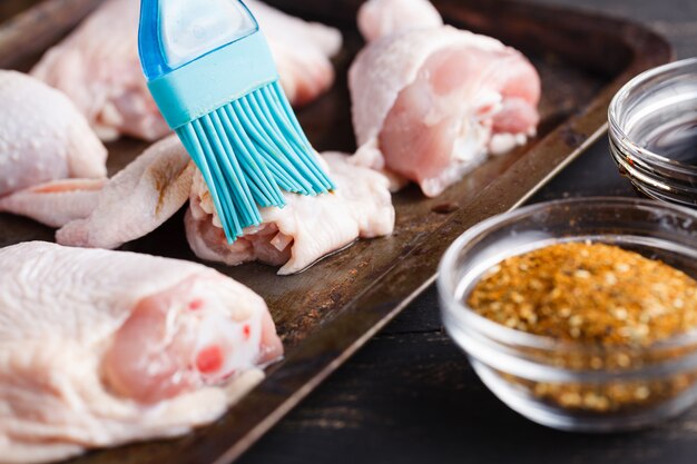 Cooking chicken leg, close up with spices