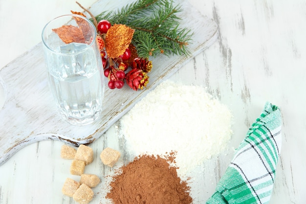 Cooking Christmas cookies on wooden table