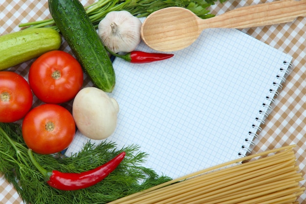 Cooking concept Groceries with empty cookbook close up