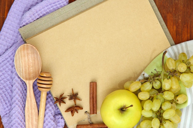 Cooking concept groceries with empty cookbook close up